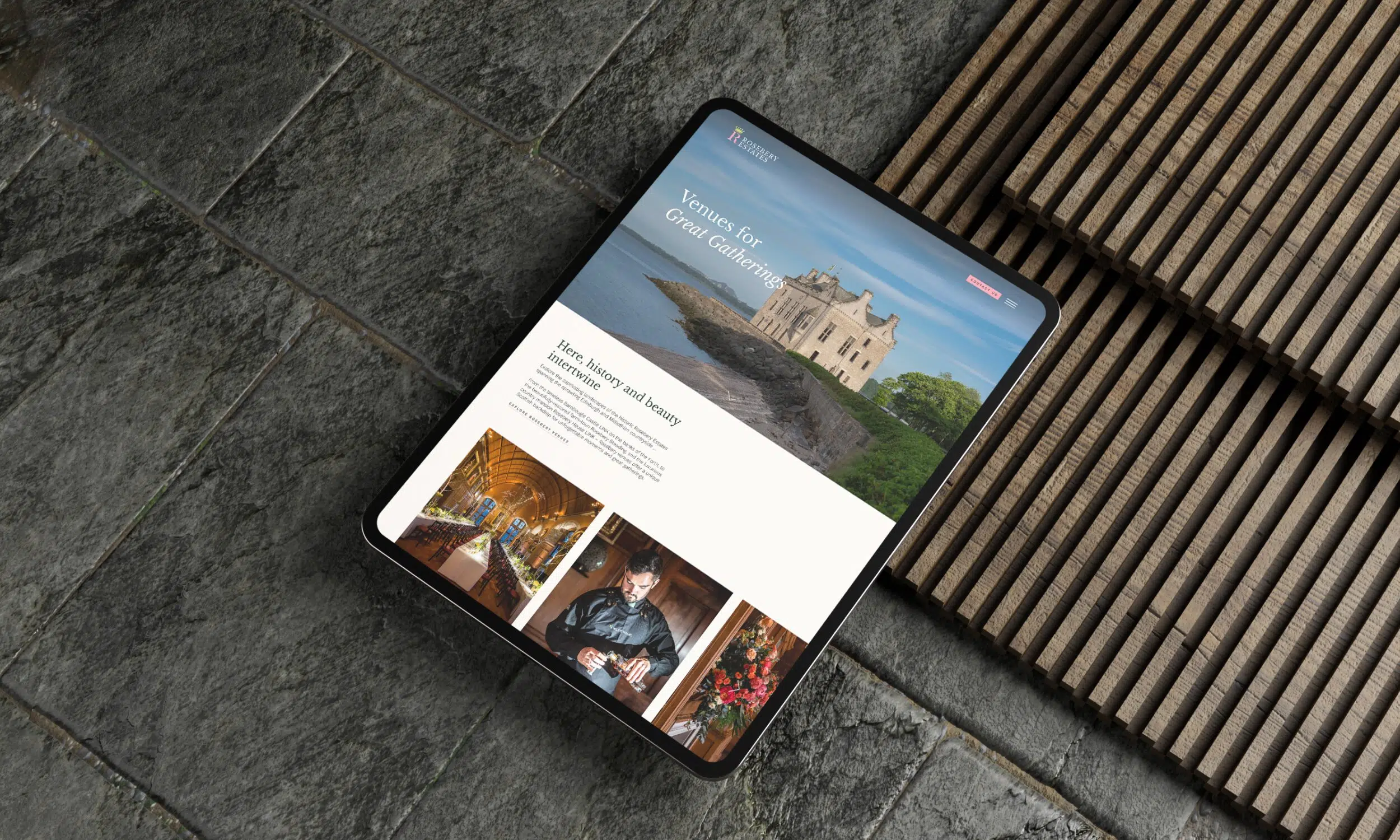 Tablet displaying Rosebery Estates wedding venue website with historic castle exterior and interior event imagery